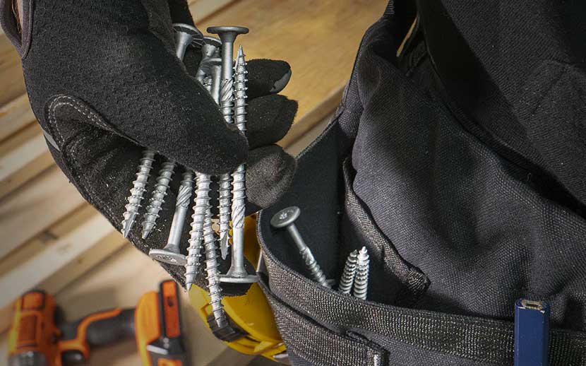 Removing a handful of structural screws from a tool belt